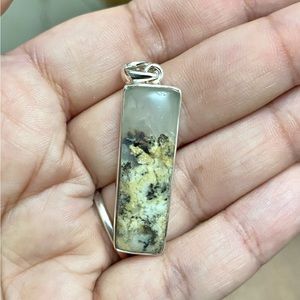 Genuine Tiger Dendrite Pendant set in solid 925 Sterling Silver.